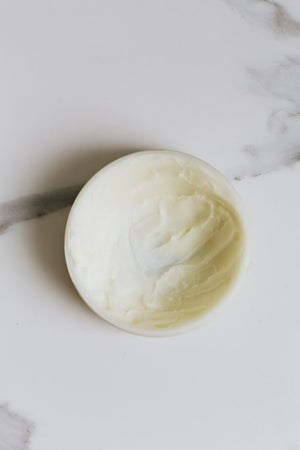 Scoop of creamy shea butter
