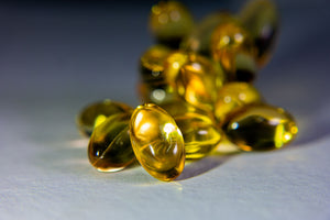 Golden vitamin E softgels